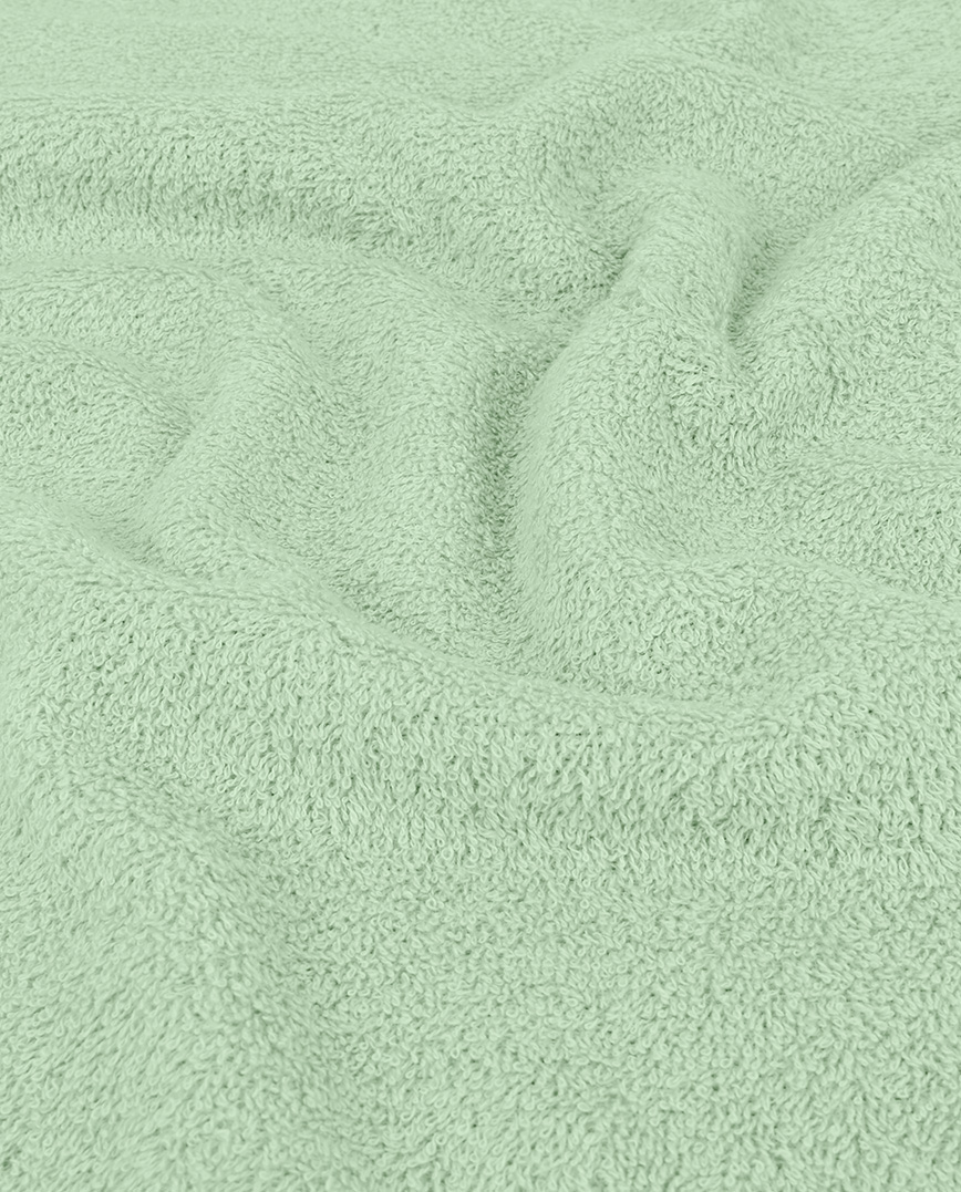 Towelling fabric with an absorbent looped surface